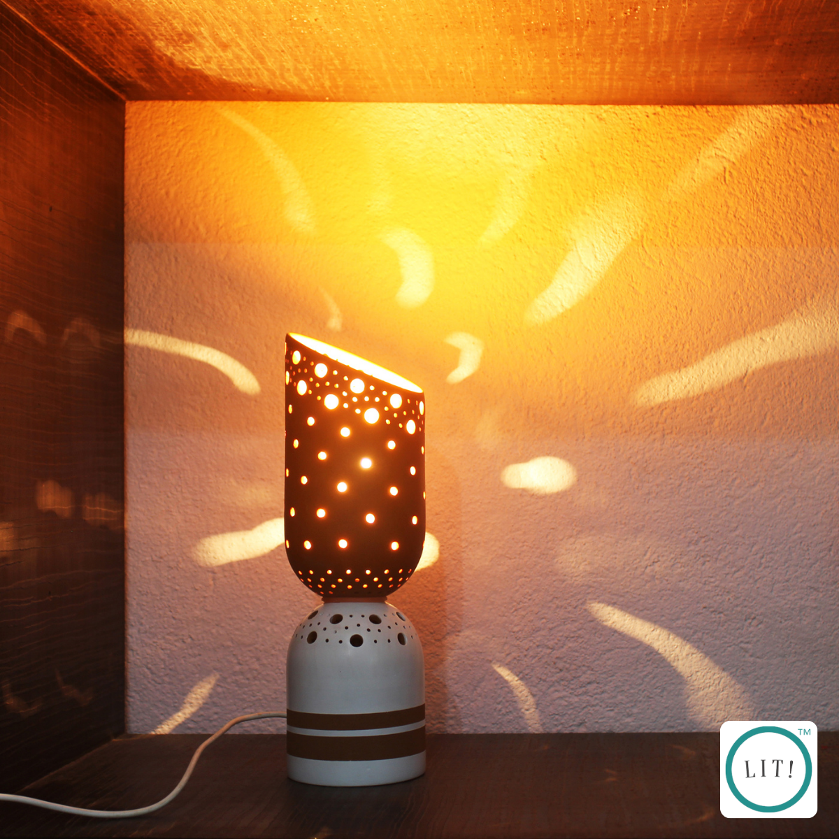 Handmade terracotta slice lamp featuring white stripe