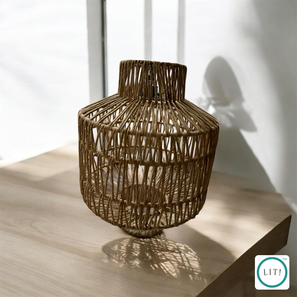 Woven paper rope pendant light with powder‑coated metal frame