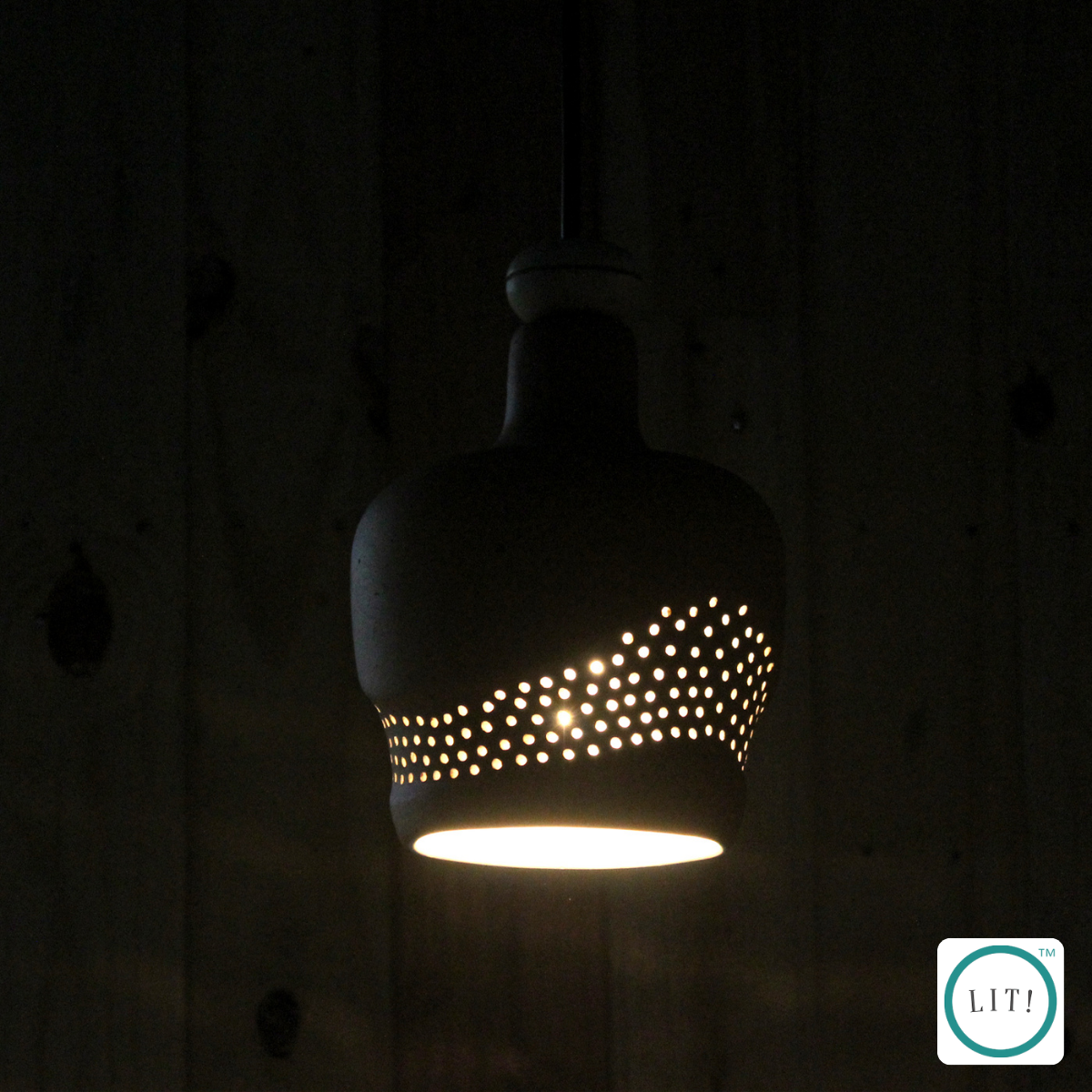 Handmade terracotta pendant with organic wave design