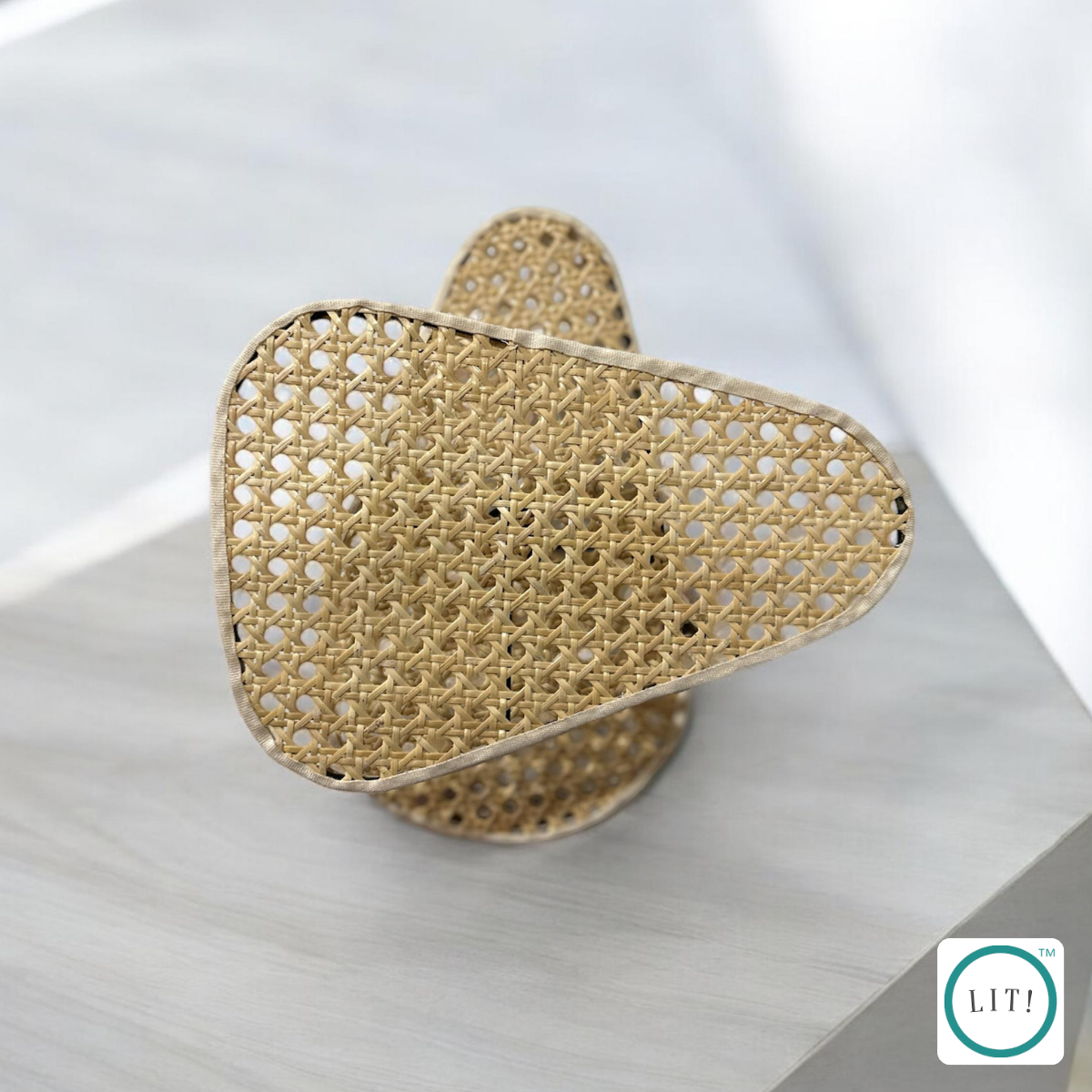 Organic bamboo rattan wall lamp with sleek metal support