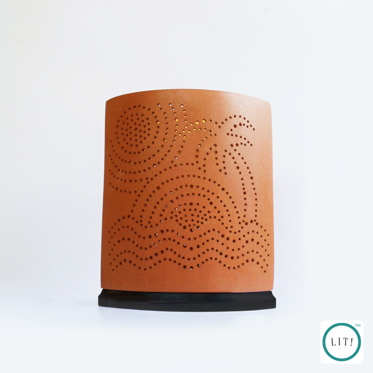 Terracotta eye‑formed lamp for warm ambient glow